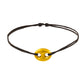 Bracelet cordon noir avec un graine de café en or 18 carats.