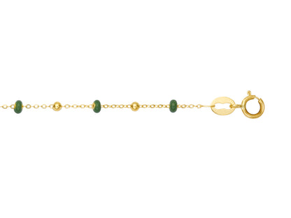 Bracelet boule en or 18 carats et résine verte pour femme.