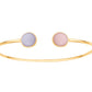 Bracelet jonc ouvert en or jaune 18 carats orné à ses extrémités d'un cabochon d'opale rose et d'améthyste.