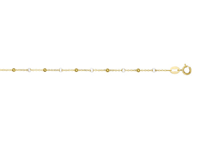 Bracelet style Gigi Clozeau en or 18 carats avec des boules de résine blanche.