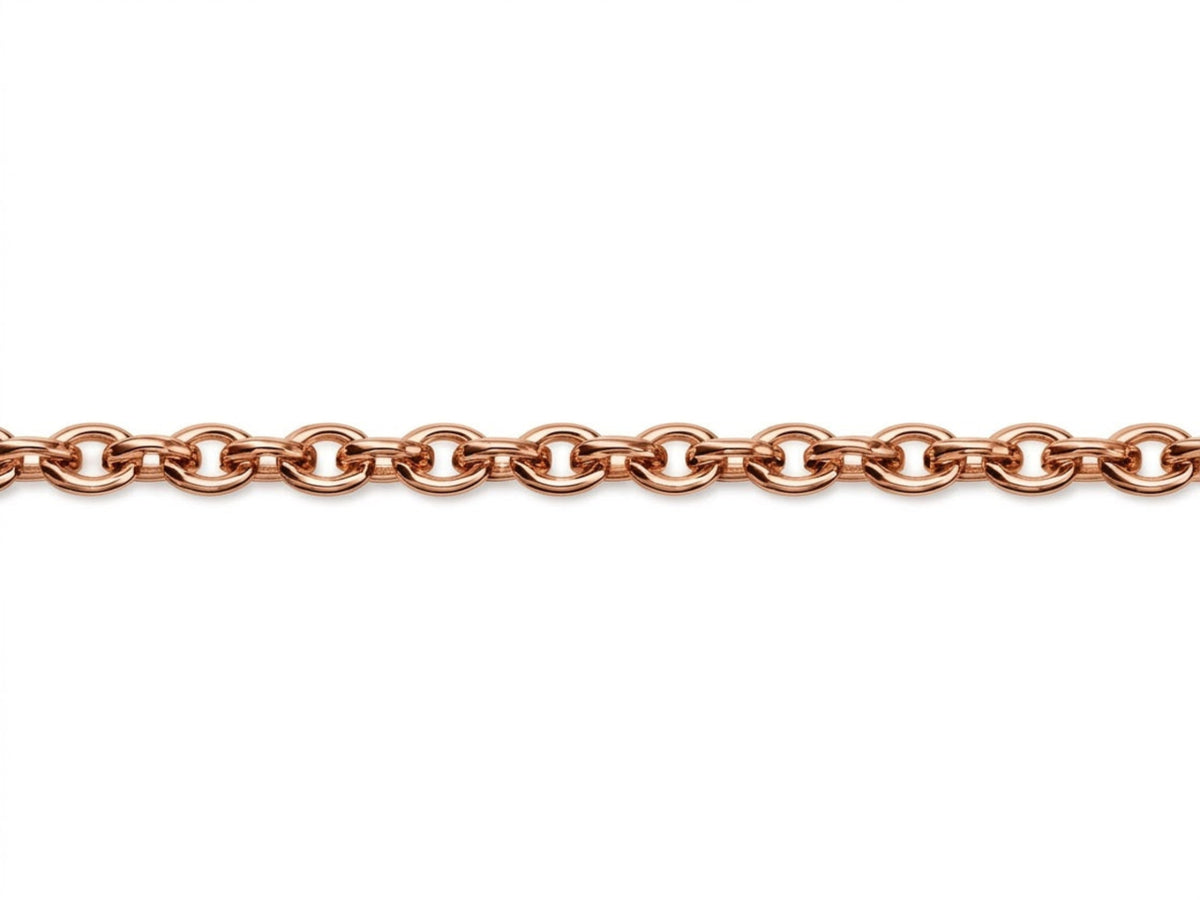 Gros plan macro sur les maillons ronds massifs de la chaîne maille forçat en or rouge (rose) 18 carats montrant la solidité du fil d'or plein.