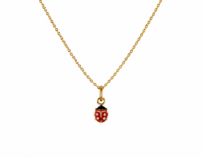 Collier pour enfant en or jaune 18 carats avec pendentif coccinelle rouge et zirconium.