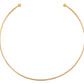 Collier torque ouvert devant de type jonc rigide en or jaune 18 carats de 2mm d'épaisseur.